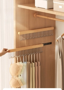 Detail of pull-out solid wood wardrobe hook with 20 metal waves for organizing camisoles