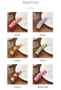 Six different colors of flower-shaped hair banana clips with rhinestone details