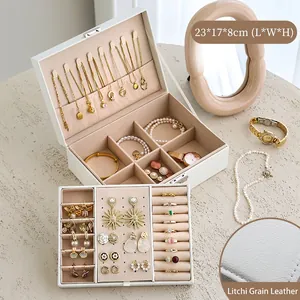 Litchi grain leather jewelry box showing necklace hooks and ring slots compartments