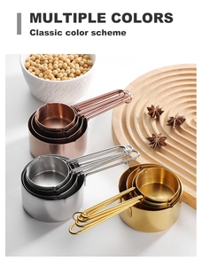 Nesting stainless steel measuring cups in rose gold, silver, and gold for baking