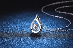 Macro shot of 925 silver pear-shaped pendant with a sparkling 1-carat moissanite stone