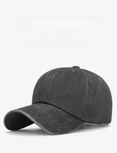 Detail view of washed cotton twill baseball cap in charcoal grey with curved brim