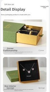 Detail of luxury forest green jewelry gift box with gold drawer and sponge inserts