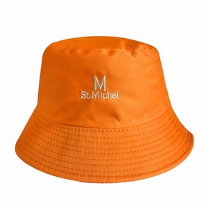Detailed close-up of orange cotton bucket hat with M St. Michel white embroidery