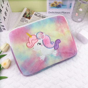 Detailed close-up of unicorn embroidery on colorful tie-dye plush iPad sleeve case