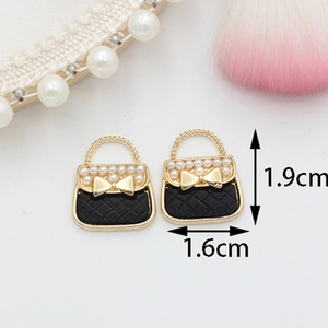 DIY black quilted handbag charm with pearl and bow detail, sized 1.9cm x 1.6cm