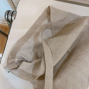 Detailed view of the durable herringbone weave texture inside the beige canvas tote bag
