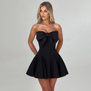 Detail view of black sleeveless tube dress with a large decorative bow and A-line skirt