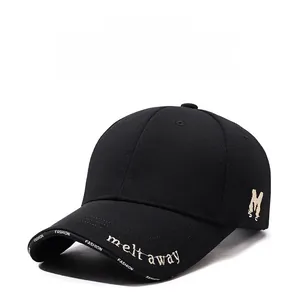 Detailed embroidery of letter M and golden text on black cotton baseball cap