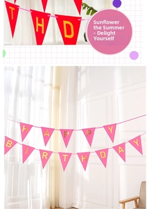 Detail of red and pink Happy Birthday triangular banners with gold foil letters for party