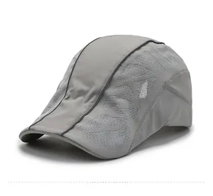 Detail view of the breathable mesh vents and sport text on this gray quick-dry beret cap