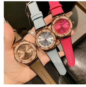 Three multi-color rhinestone quartz watches with silicone bands and calendar display