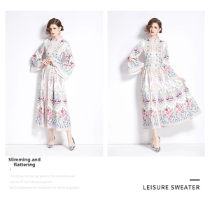 Close-up of ethnic style maxi dress with floral print, stand collar and trumpet sleeves