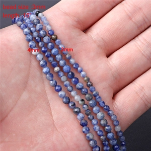 Detailed comparison of 3mm and 4mm faceted blue spotted stone beads for jewelry making
