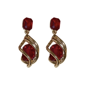 Vintage gold spiral earrings with octagonal deep red crystals for a luxury aesthetic