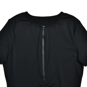 Detail shot of the black slim fit bodysuit featuring a functional front zipper closure