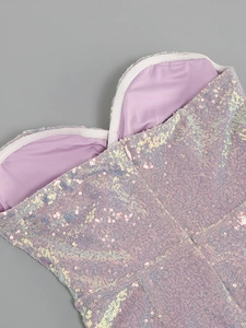 Detail of purple sequin dress showing the neckline and hidden zipper closure