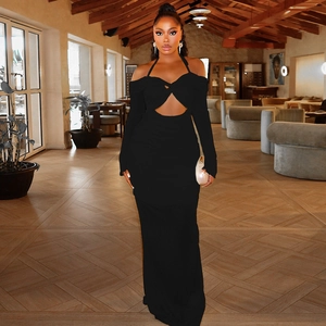 Detail of black cutout halter maxi dress with long sleeves and elegant ruched texture