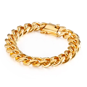 Detail of gold Cuban link bracelet showing the heavy polished metal texture and secure clasp