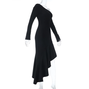 Detail view of the asymmetric ruffled hem on this elegant black one-shoulder maxi dress
