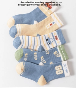 Detail showing five pairs of cotton children socks with colorful cartoon car patterns