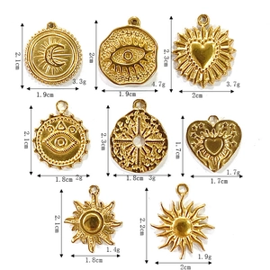Gold stainless steel sun, moon, and evil eye charms set with dimensions and weight