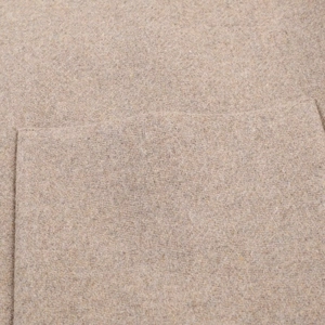 Close-up of beige wool blend fabric texture showing the premium material and stitching