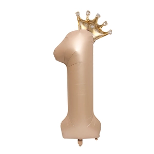 Detail of champagne gold number 1 foil balloon with golden crown for birthday parties