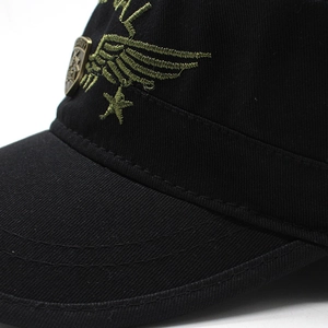 Detail of army style cadet cap with embroidered wings, star, and bronze metal shield badge