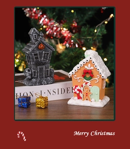 Miniature resin gingerbread house and ghost house on a cozy festive tabletop display