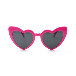 Macro detail of glossy pink heart-shaped party sunglasses with dark grey lenses