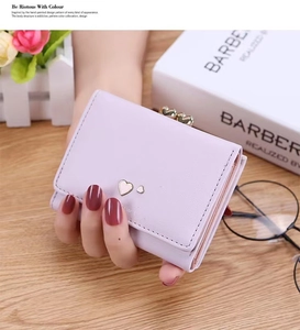Compact lavender tri-fold leather wallet with heart metal snap and vintage kiss-lock closure