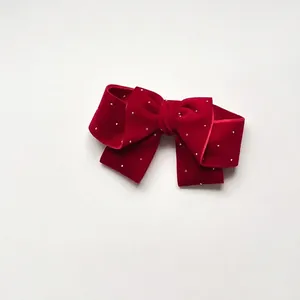 Velvet red oversized bow hair clip with faux pearl embellishments for girls