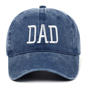 Close-up of white DAD embroidery on washed dark blue cotton canvas baseball cap