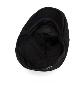 Detailed inside view of black newsboy cap showing fabric texture and adjustable buckle