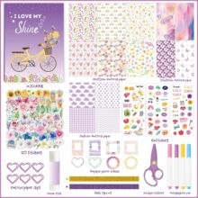 Flat lay macro of a purple DIY journal kit including stickers and stationery tools