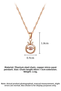 Detail of rose gold crown pendant with dancing zircon and size 1.8x0.9cm on steel chain