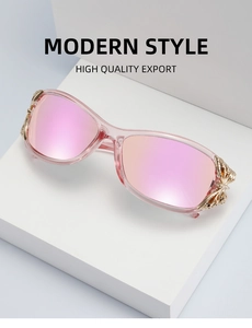 Detailed close-up of pink Y2K sunglasses featuring intricate gold metal butterfly hinges