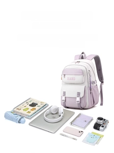 Detail view of large capacity purple backpack showing storage for laptop and books