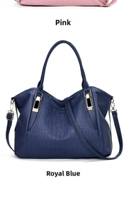 Detail view of crocodile pattern faux leather tote bags in pink and royal blue colors