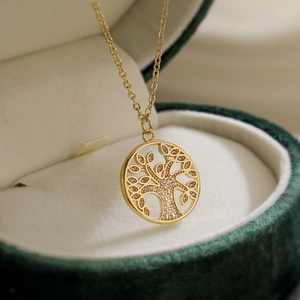 18K gold plated tree of life necklace with clear zircons in a green velvet jewelry box