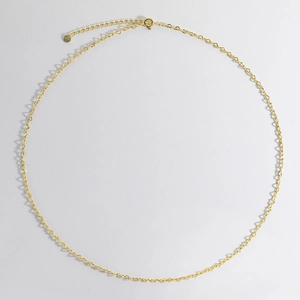 Close-up of golden S925 sterling silver necklace spring clasp and authenticity tag