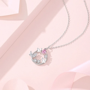 S925 silver necklace with circular pendant featuring a pink heart zircon and butterfly