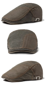 Detail view of cotton patchwork flat cap with metal side buckles and twill texture
