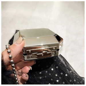 Detailed macro view of the silver octagonal prism metal evening bag with polished finish