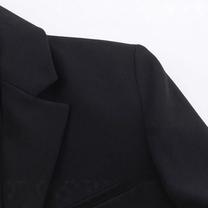 Women's black lace blazer dress with tailored shoulders and elegant holiday resort style