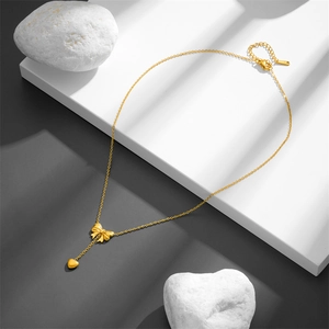Minimalist gold stainless steel bow and heart tassel pendant necklace for women