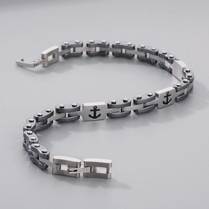 Detailed macro view of anchor-patterned stainless steel watch chain bracelet for men