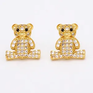 Sparkling gold bear stud earrings for women with inlaid white crystals and black gem eyes