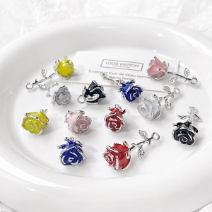 Gothic rose enamel charms in various colors on ceramic plate for DIY jewelry making